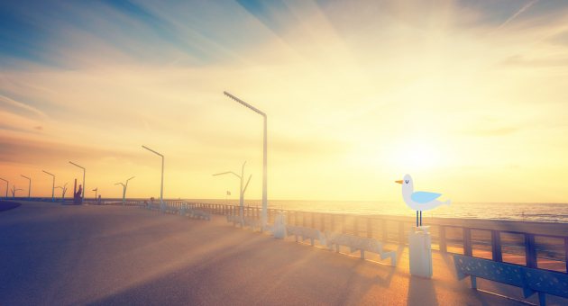 Zonsondergang op de boulevard van Scheveningen met een digitale meeuw op een paaltje bij zee