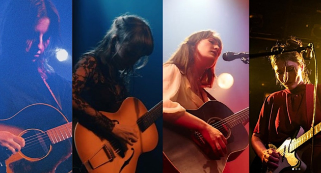 Een vrouw speelt gitaar tijdens een optreden op het podium.