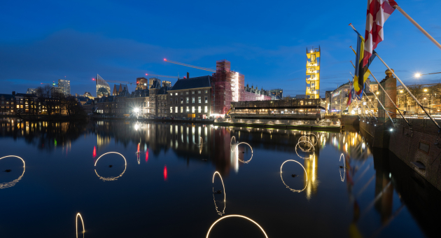 Lights reflecting in the Hofvijver at night.
