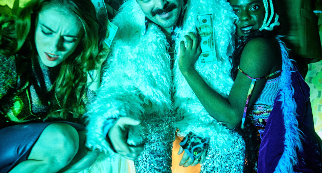 Three people in flamboyant clothing holding money.