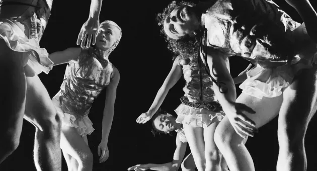 Group of dancers in stylish costumes on stage