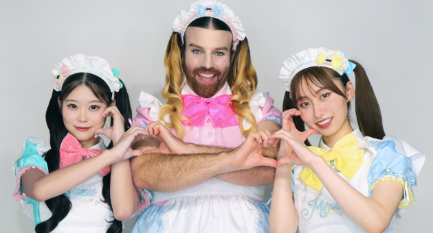 BABYBEARD trio on stage in colourful kawaii outfits during a heavy metal performance