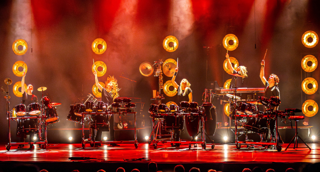 Slagerij van Kampen performing on percussion instruments during a live show