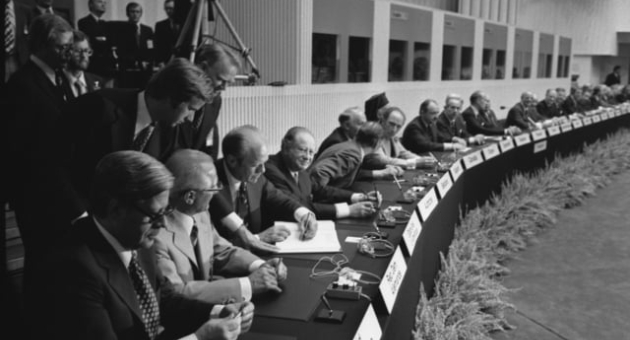 photograph-of-president-gerald-r-ford-signing-the-final-act-of-the-conference-689800-(1.jpg