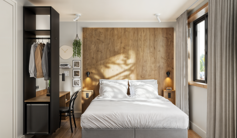 Knusse hotelkamer in Townhouse hotel Den Haag met een heerlijk Auping bed.