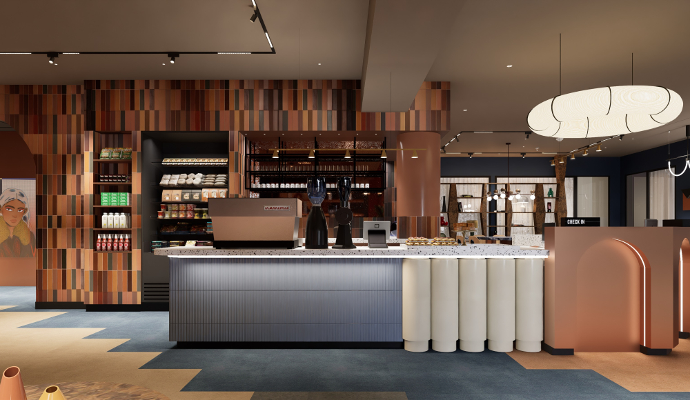 Innenansicht eines modernen Cafés mit einer langen Theke, bunten Wänden und Kunstwerken.