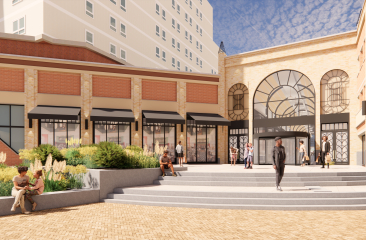 Mensen genieten van een nieuwe winkelplek Palace Promenade Scheveningen met planten en terrassen.