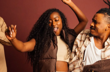 A group of friends joyfully dancing together.