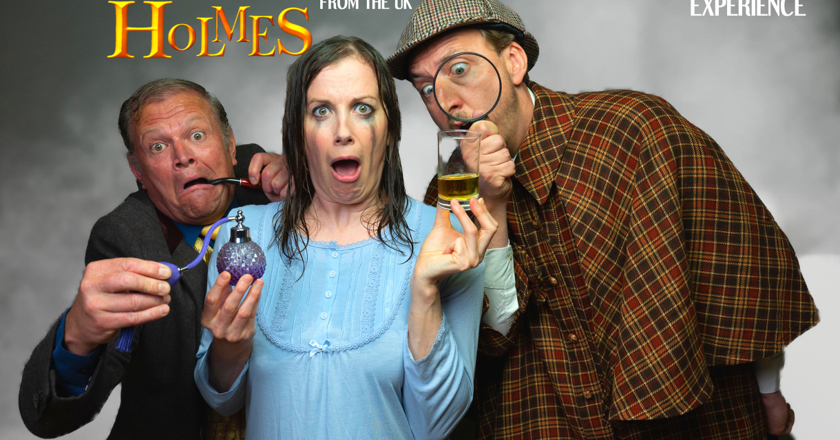 Drie acteurs in komische Sherlock Holmes-stijl poseren met overdreven geschrokken gezichten, als promotie voor de voorstelling Sheer Luck Holmes. Drie acteurs in komische Sherlock Holmes-stijl poseren met overdreven geschrokken gezichten, als promotie voor de voorstelling Sheer Luck Holmes.