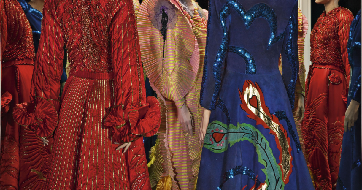 Various colorful dresses in a fashion display. Three designs from Fong-Leng: Velazquez (1975), Rups (1975) and Phoenix (1974).