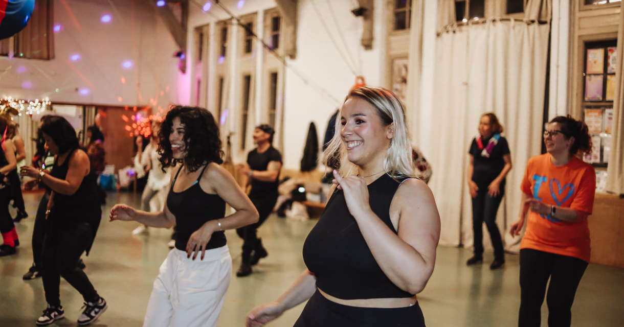 Group dance in a hall. Women dancing together in a lively hall.