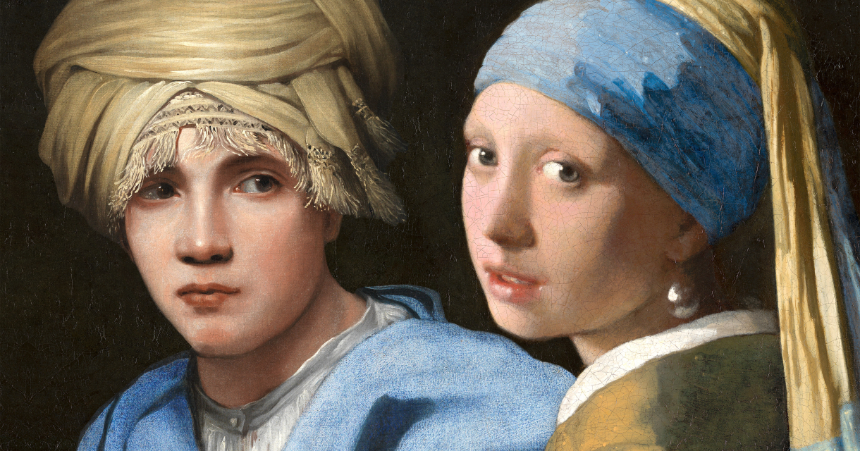 Two individuals, a boy and a girl, dressed in historical clothing.