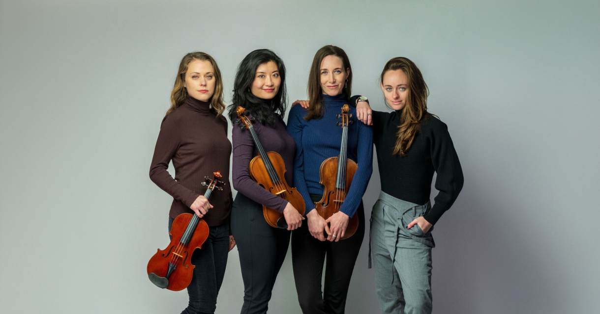 Spaceship Ensemble + Pi Quartet. Four violinists pose with their instruments.
