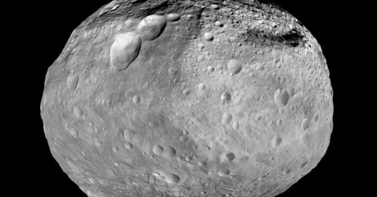 An asteroid with a rough, irregular surface and many craters.