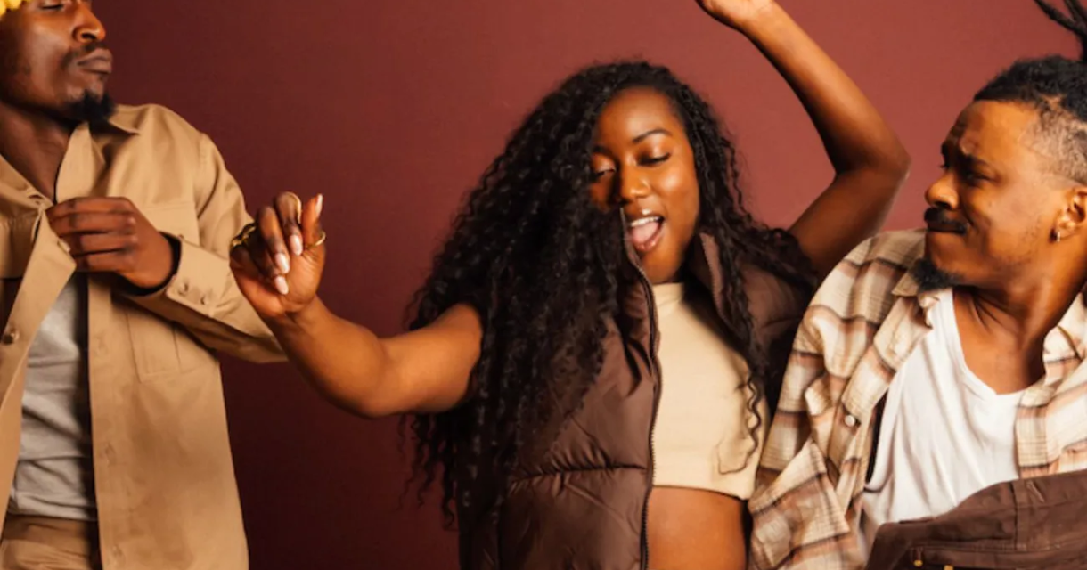 A group of friends joyfully dancing together.