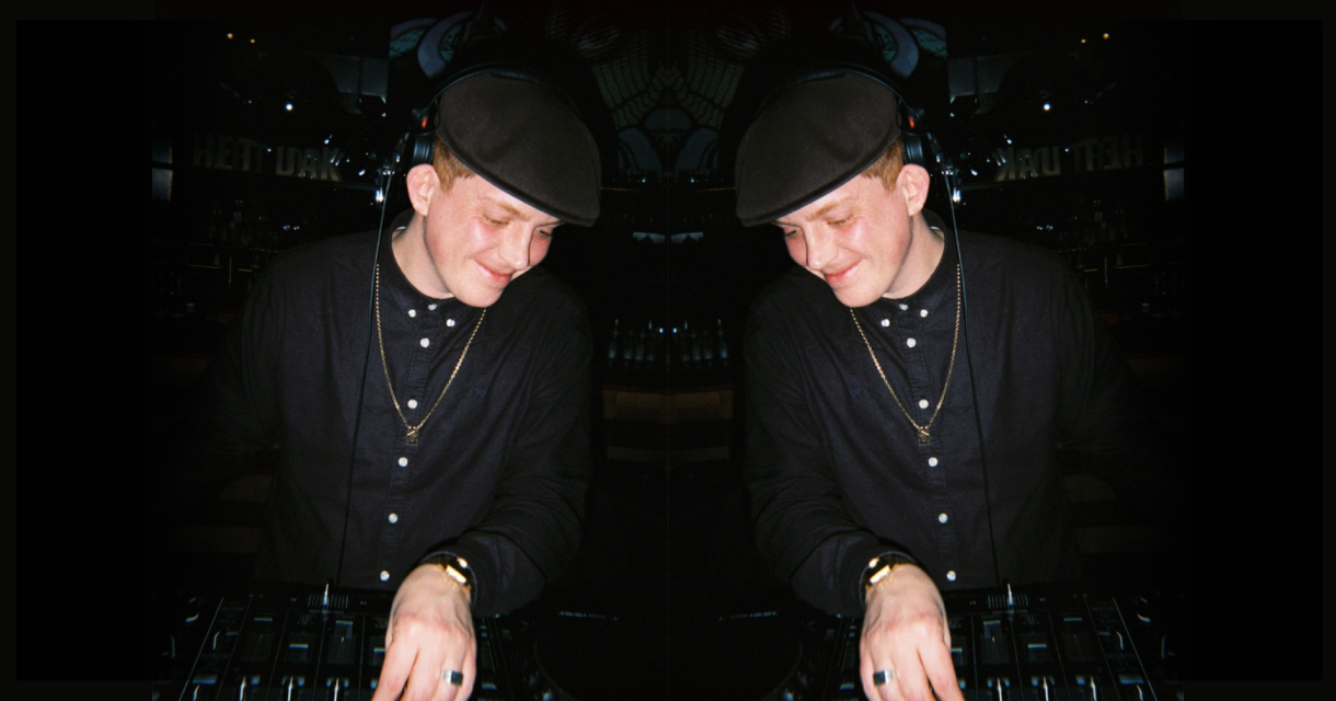 DJ Ginger ILL behind the decks during a late-night performance