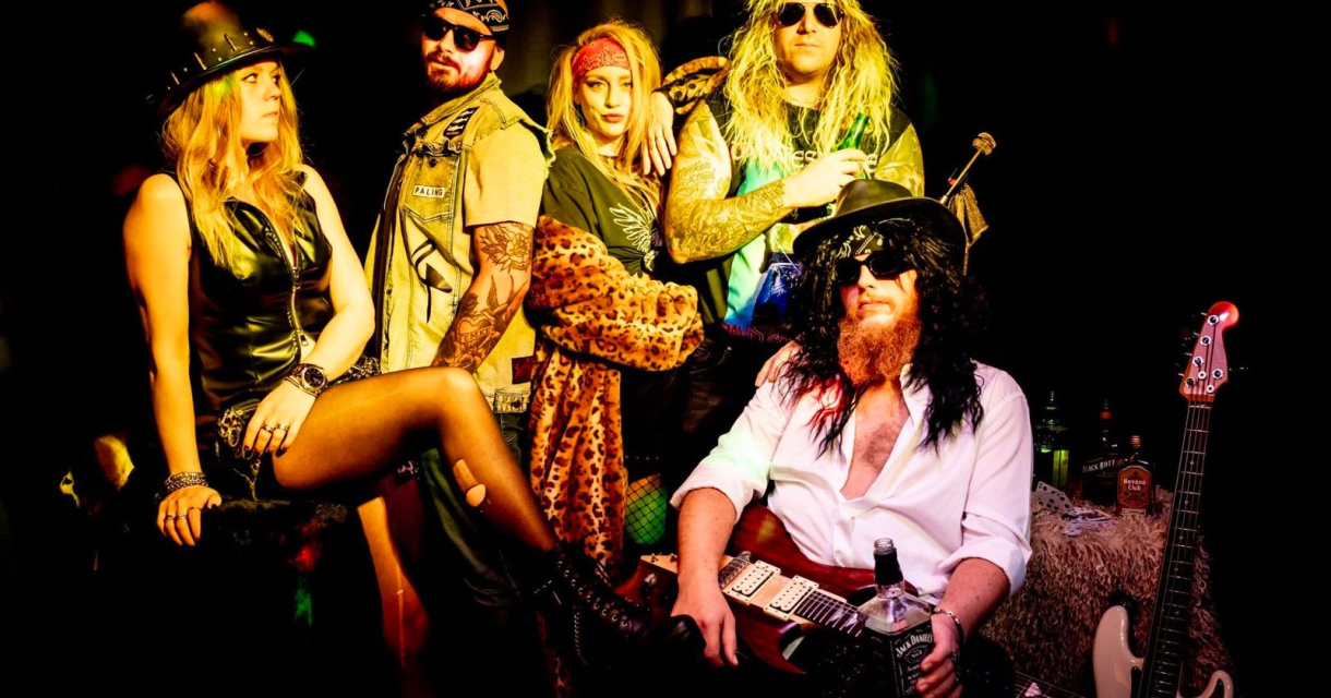 Cover band performing on stage at Podium aan Zee during the Halloween edition of the Scheveningse Cover Night