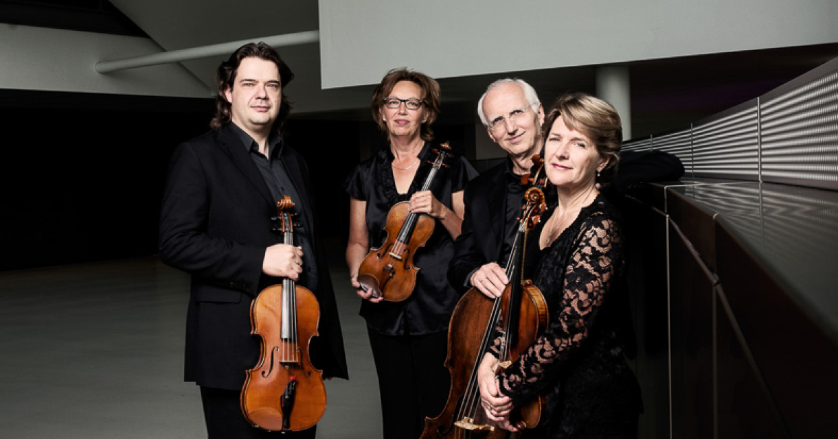 The four musicians of the Utrecht String Quartet performing on stage.