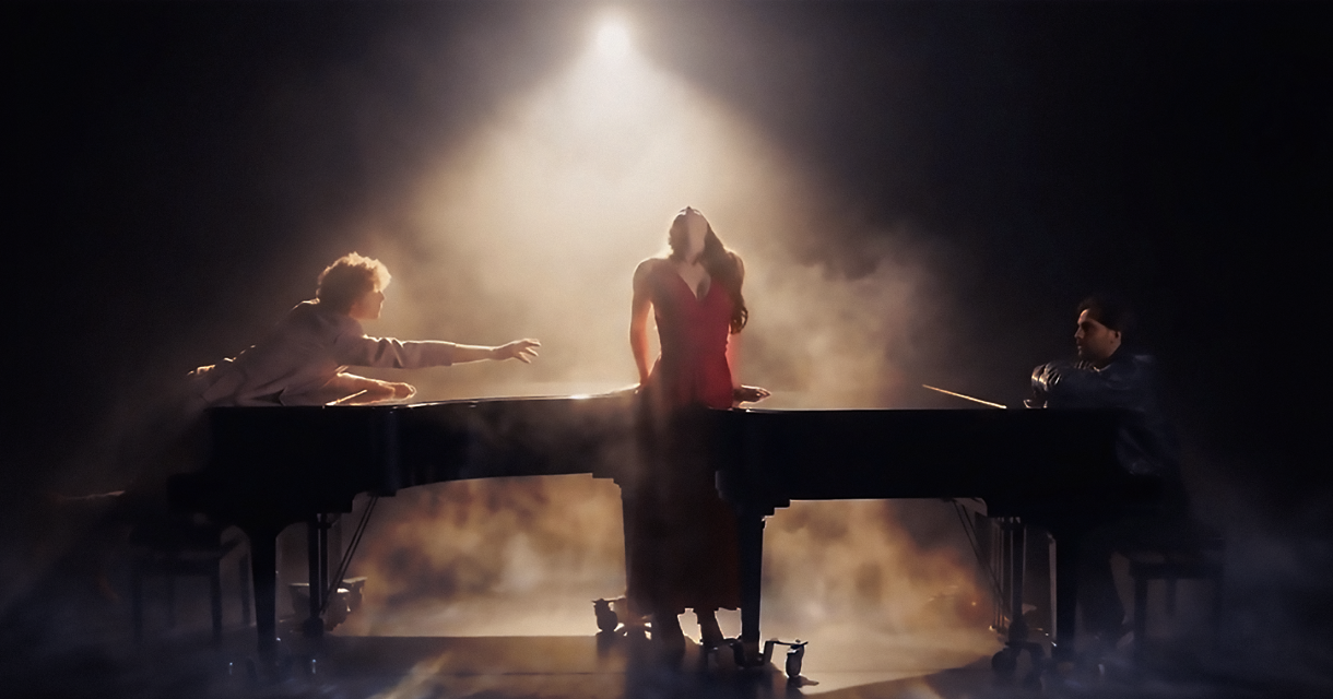 Singers from De Nationale Opera Studio performing in and around a grand piano